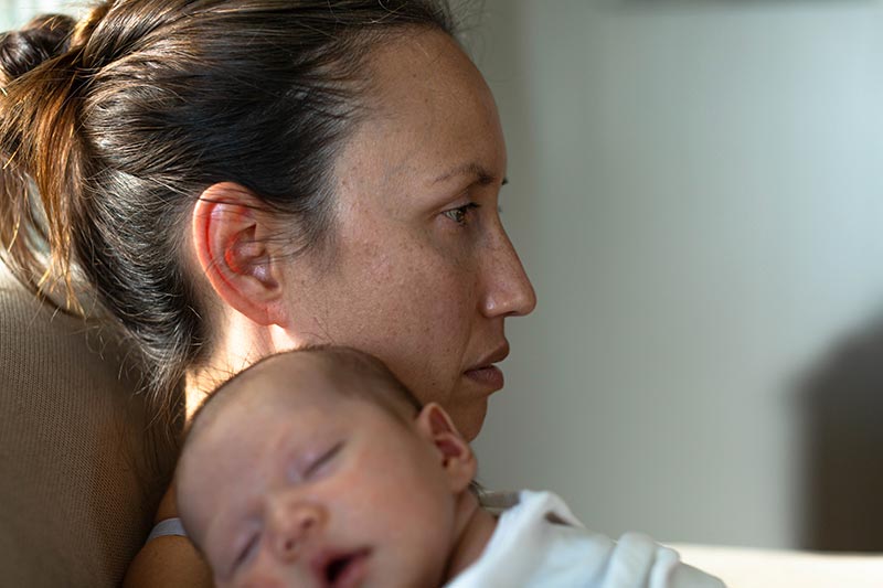 mum holding baby